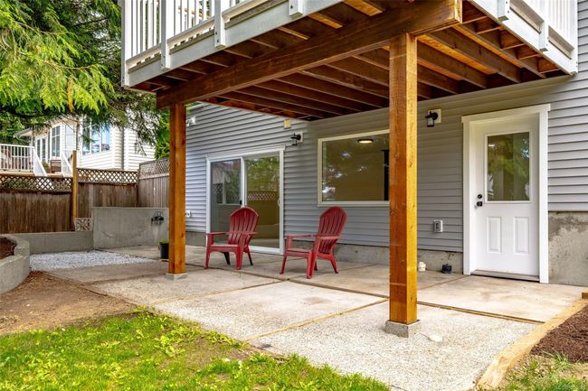 Covered downstairs entrance and patio space | Image 60