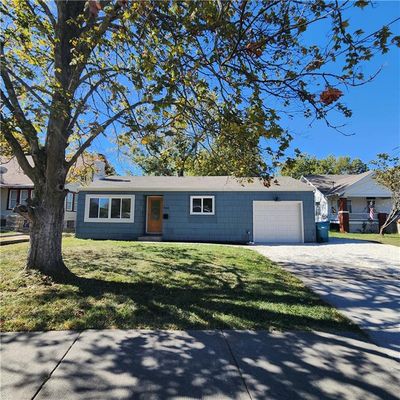 View of front of home featuring a front yard and a garage | Image 3