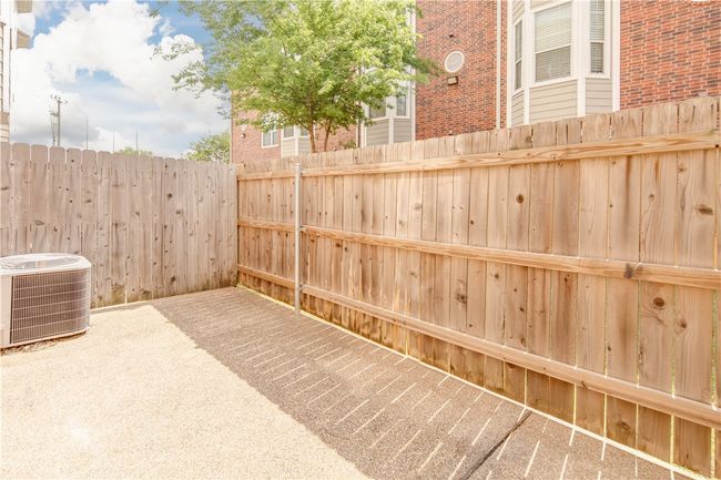 View of patio / terrace featuring fence and central AC unit | Image 12