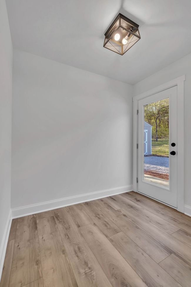 Laundry room on the main level and it even has an exterior door that leads to the back yard. Could also use this space as a mud room. | Image 27