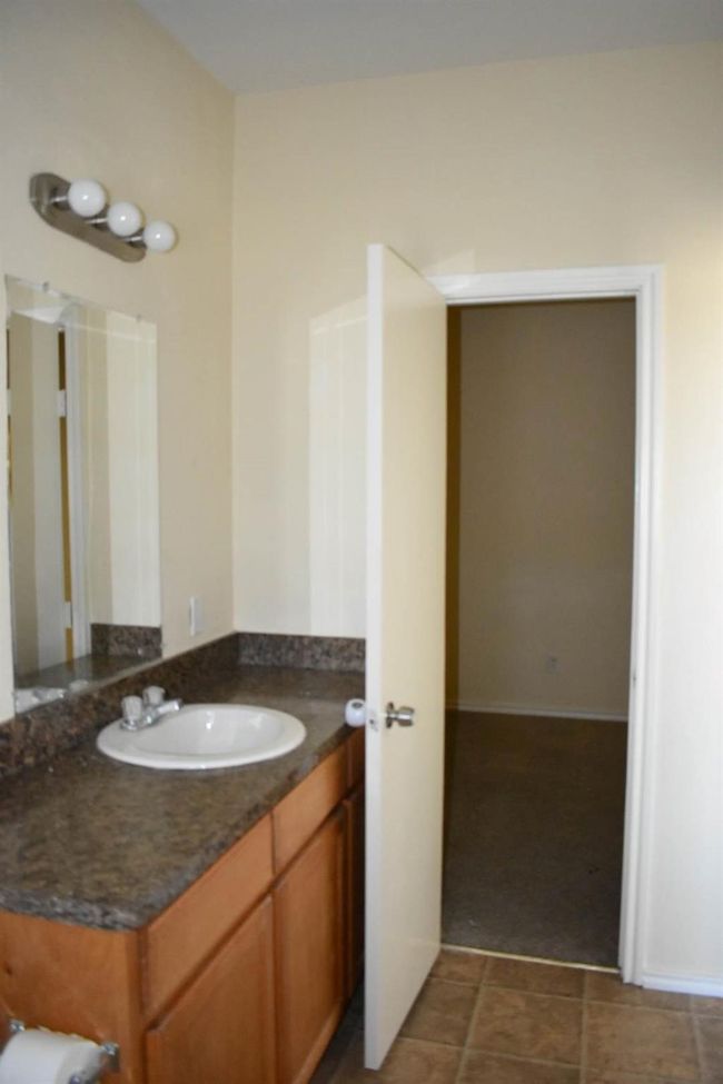 Bathroom with tile patterned flooring and vanity | Image 8