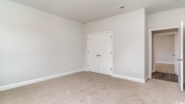 Unfurnished bedroom featuring a closet and carpet floors | Image 5