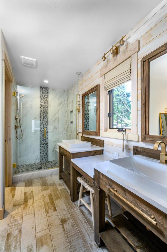 Primary bath featuring double sinks and a spacious shower. | Image 20