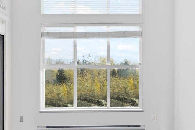 Interior details with a baseboard heating unit | Image 7