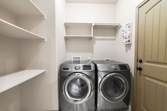 Washroom featuring washing machine and dryer | Image 37