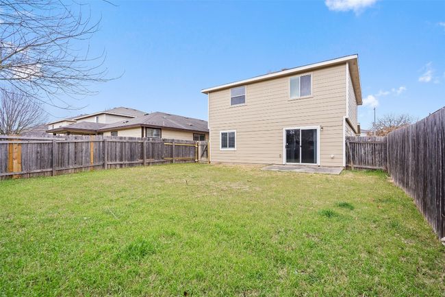 Rear view of house with a fenced backyard | Image 34