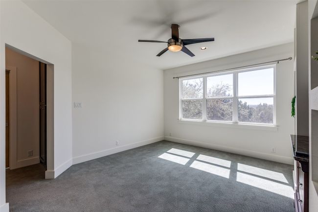Empty room featuring ceiling fan, carpet, and baseboards | Image 21