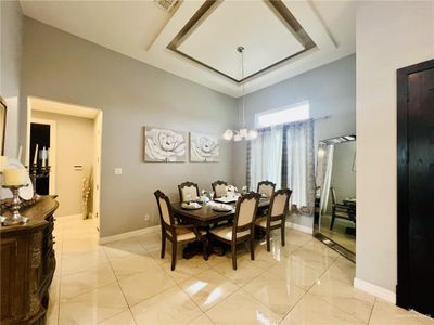 Dining area featuring light tile patterned floors | Image 2