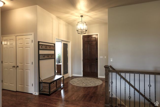 Foyer featuring a chandelier, wood finished floors, and baseboards | Image 21