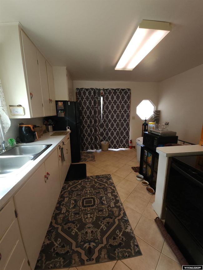 301 11 Th St, House other with 3 bedrooms, 1 bathrooms and null parking in Wheatland WY | Image 9