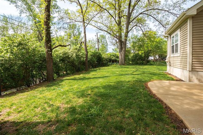 View of yard with a patio | Image 43