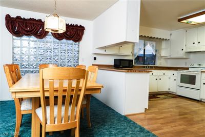 Spacious dining room with ample room for a table for six or more, featuring plenty of natural light | Image 3