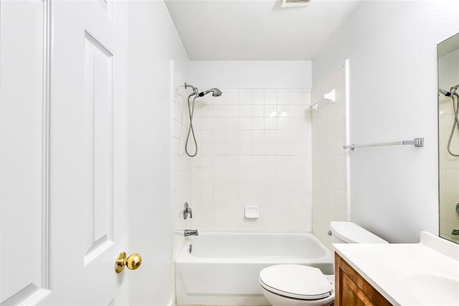 Full bath featuring vanity and bathtub / shower combination | Image 17