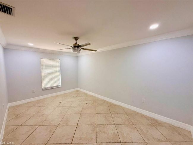 Empty room featuring recessed lighting, ornamental molding, visible vents, a ceiling fan, and light tile patterned flooring | Image 22