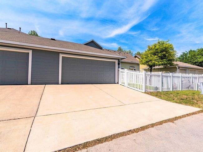 The alley access two car garage and driveway with room for additional parking. | Image 28