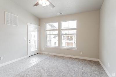 Empty room featuring ceiling fan and carpet flooring | Image 3