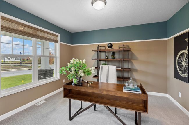 Photo is of the actual model. The main level flex room. | Image 10