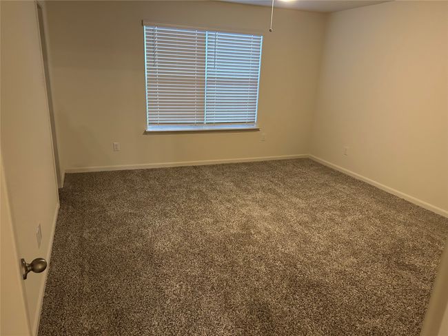 Carpeted spare room featuring baseboards | Image 8