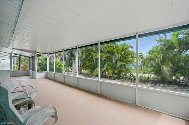 Unfurnished sunroom with plenty of natural light | Image 14