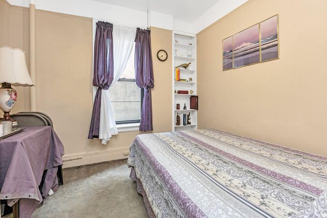 Carpeted bedroom featuring baseboards | Image 5