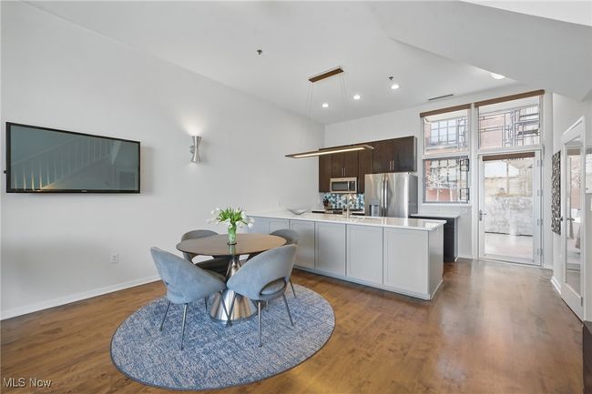 Dining space with baseboards, wood finished floors, visible vents, and recessed lighting | Image 11
