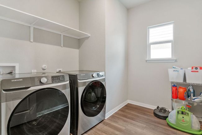Large laundry room adjacent to mud room. | Image 18