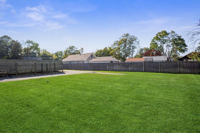 View of yard featuring a fenced backyard | Image 18