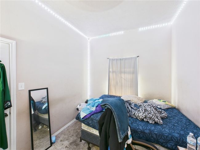 Bedroom with carpet floors and baseboards | Image 12