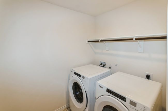 Laundry room with washer and dryer and baseboards | Image 27