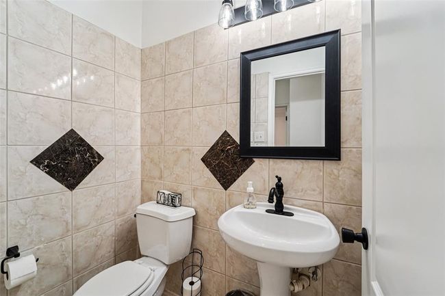 Half bath on the first floor, ideal for guests. | Image 29