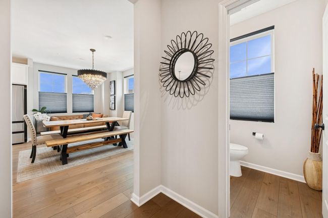 Half bath on the main level, thoughtfully positioned next to the dining area for easy access and guest convenience. | Image 25