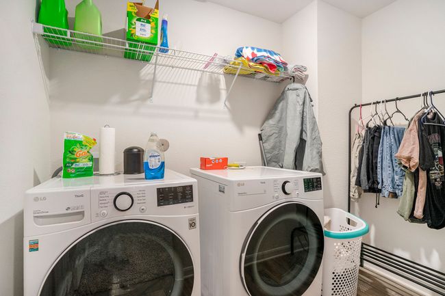 Clothes washing area featuring washing machine and dryer and laundry area | Image 24