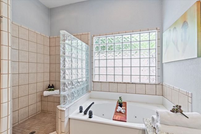 Full bath featuring walk in shower and a jetted tub | Image 18