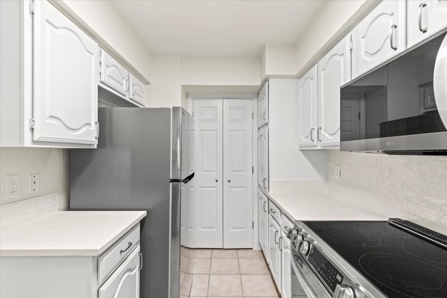 View of kitchen into the laundry room | Image 16
