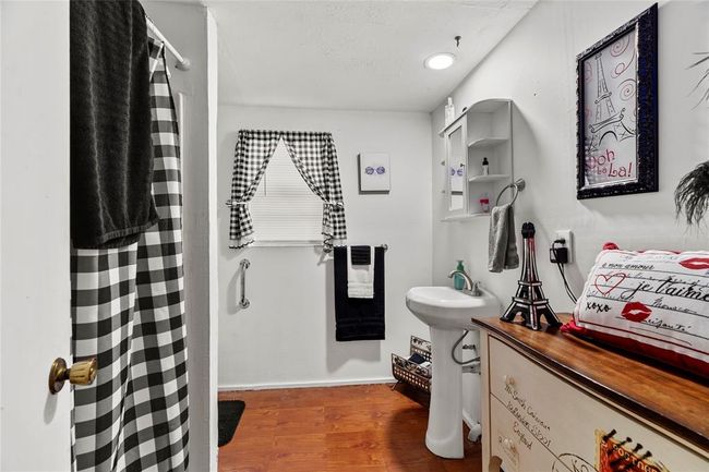 Bathroom featuring hardwood / wood-style flooring | Image 15