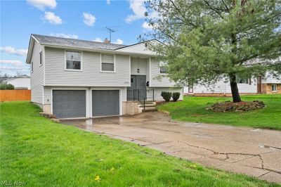 Split foyer home with a garage and a front lawn | Image 1