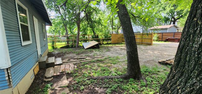 View of fenced backyard | Image 4