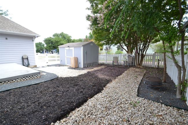 Fenced backyard featuring a shed | Image 20