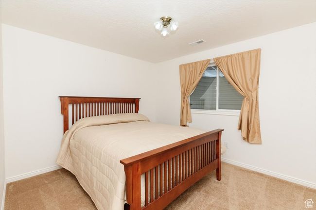 Bedroom featuring carpet flooring and baseboards | Image 55