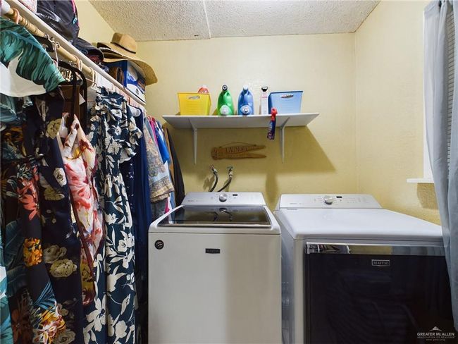 Laundry area featuring hookup for a washing machine and separate washer and dryer | Image 13