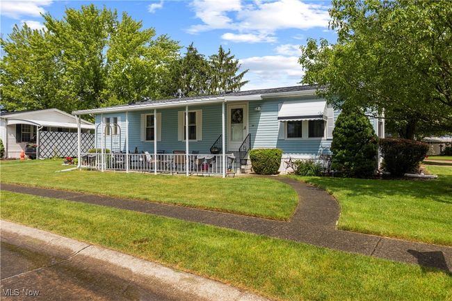 View of front facade featuring covered porch and a front yard | Image 4