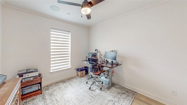 Office featuring healthy amount of natural light, a ceiling fan, and ornamental molding | Image 30