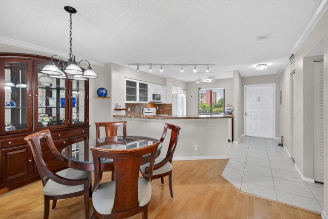 Dining Room, Kitchen, and a Tiled Foyer Entry for Easy Cleaning | Image 10
