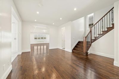 Unfurnished living room with dark hardwood / wood-style floors | Image 3