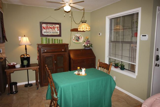 Tiled dining area featuring ceiling fan and baseboards | Image 17