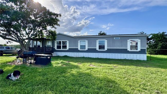 Rear view of house featuring a lawn | Image 4