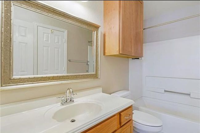 Full bathroom with bathing tub / shower combination, toilet, and vanity | Image 17