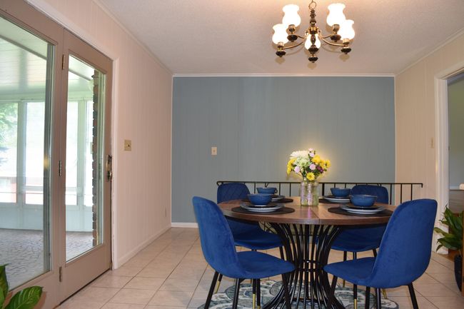 Dining leading out to Florida Room and Downstairs | Image 8
