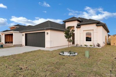 Prairie-style house featuring a garage and a front lawn | Image 2