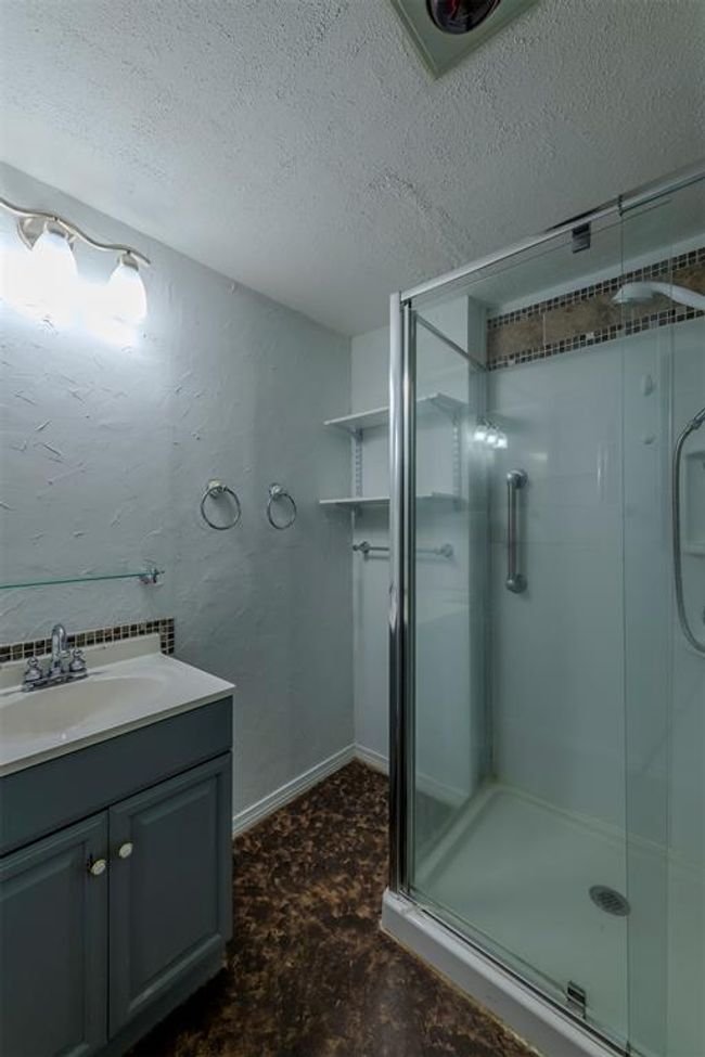 Primary bathroom features a walk-in shower and heated floor. | Image 21
